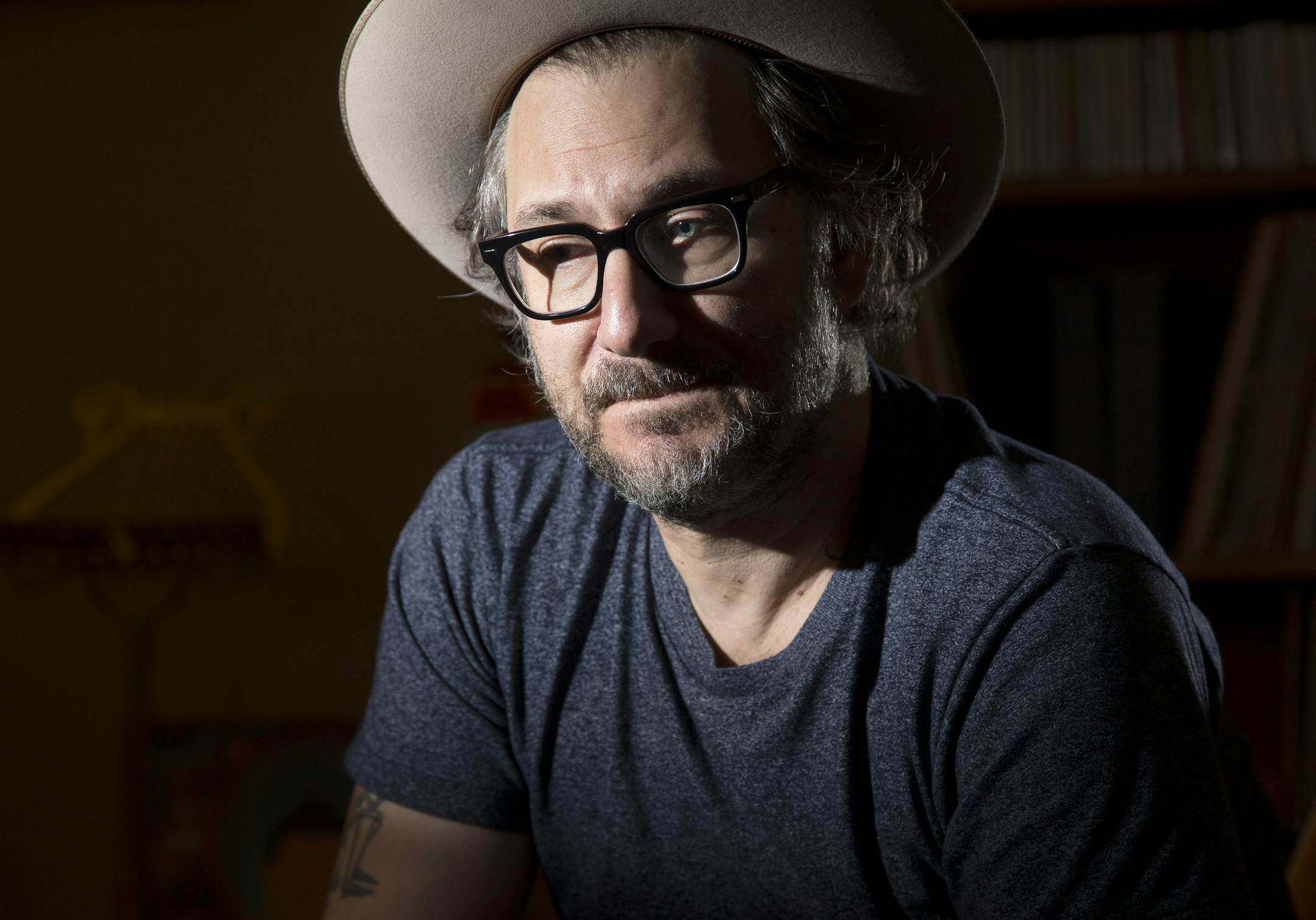 Adam Levy photographed in his Minneapolis home. ] CARLOS GONZALEZ ï cgonzalez@startribune.com - November 17, 2015, Minneapolis, MN, Some of the promotional appearances Honeydogs front man Adam Levy has done for his new album has been a Yale psychiatry seminar and the Twin Cities Jewish Mental Health Conference. The record, "Naubinway," reflects on the loss of his son to mental illness and suicide.