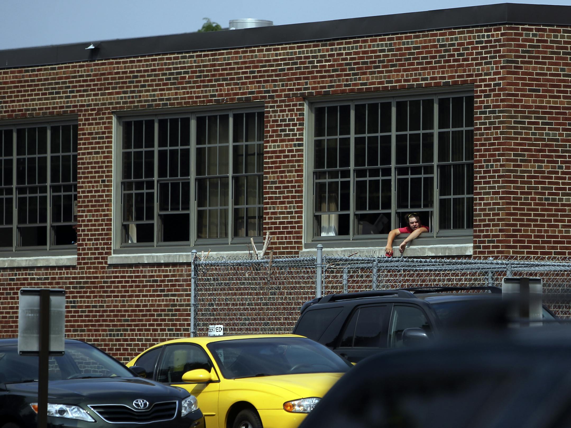 A student hung his head out a window at Patrick Henry High School Tuesday, Aug. 27, 2013](DAVID JOLES/STARTRIBUNE) djoles@startribune.com Minneapolis and area school students suffered through yet another day of brutal heat, many without the benefit of air conditioning. A protest of the hot learning conditions and press conference was held at Patrick Henry High School, following classes Tuesday, Aug. 27, 2013 organized by the Minneapolis teachers union and Neighborhoods organizing for Change. A f