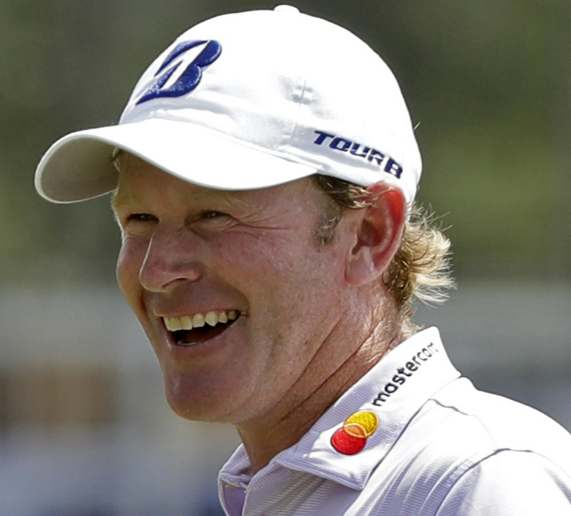 Brandt Snedeker smiles after making a birdie putt on the ninth hole during the first round of the Wyndham Championship golf tournament in Greensboro, N.C., Thursday, Aug. 16, 2018. Sneaker shot a 59 in the first round. (AP Photo/Chuck Burton)