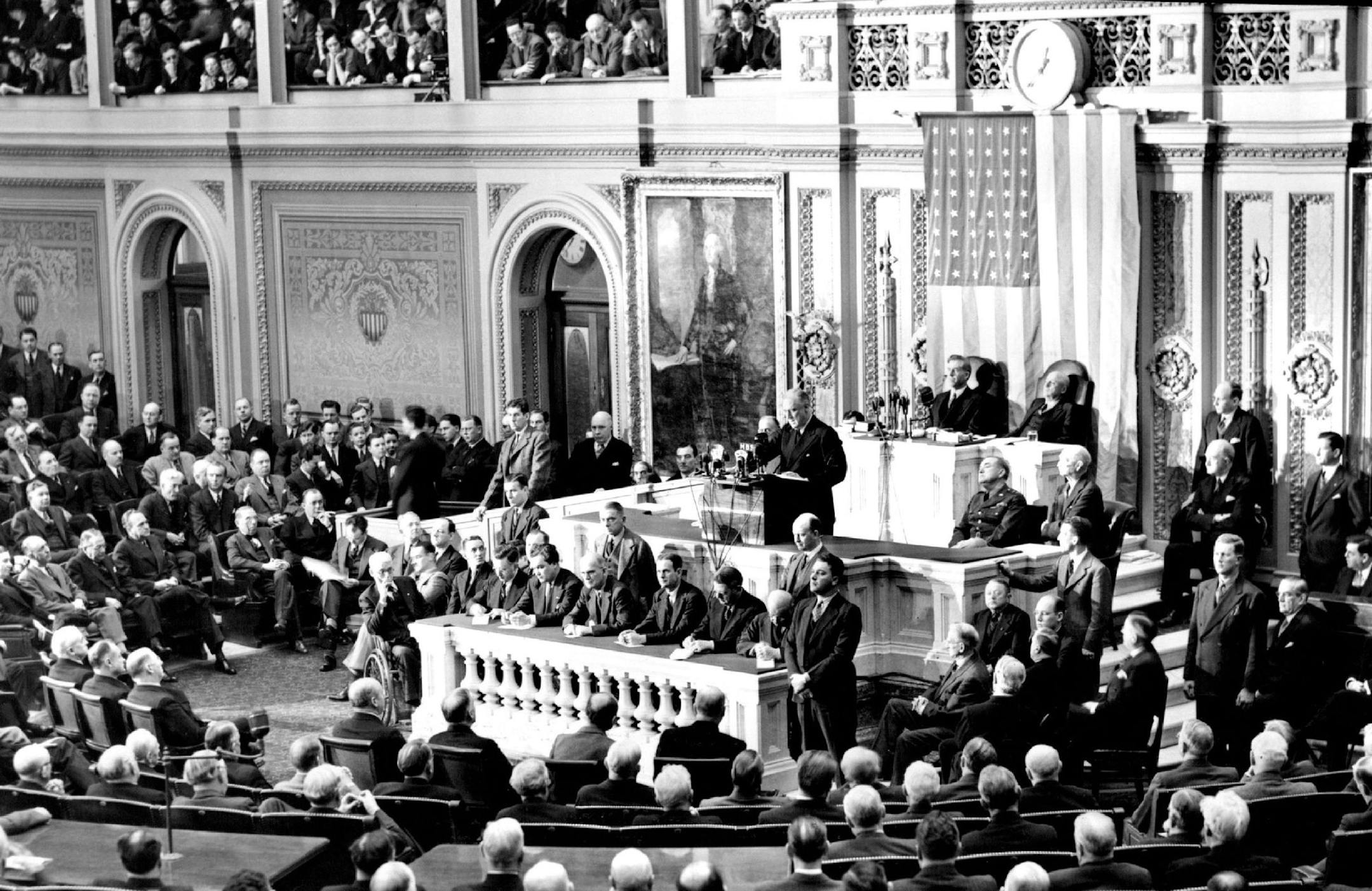 Roosevelt Delivers Message To Congress - President Roosevelt, in his stat -of-the-union ,- message delivered in person to the second session o the 77th Congress, outlined a stupendous War production program. "We'll Carry The Fight To The Enemy" he told Congress, PHOTO SHT:1S- President Roosevelt delivering his address before a joint session of Congress. Vice President Henry Wallace and Speaker of the House, San Rayburn, seated in brick. Maj Gen. Edwin M. Watson, Military Aide to the President, s