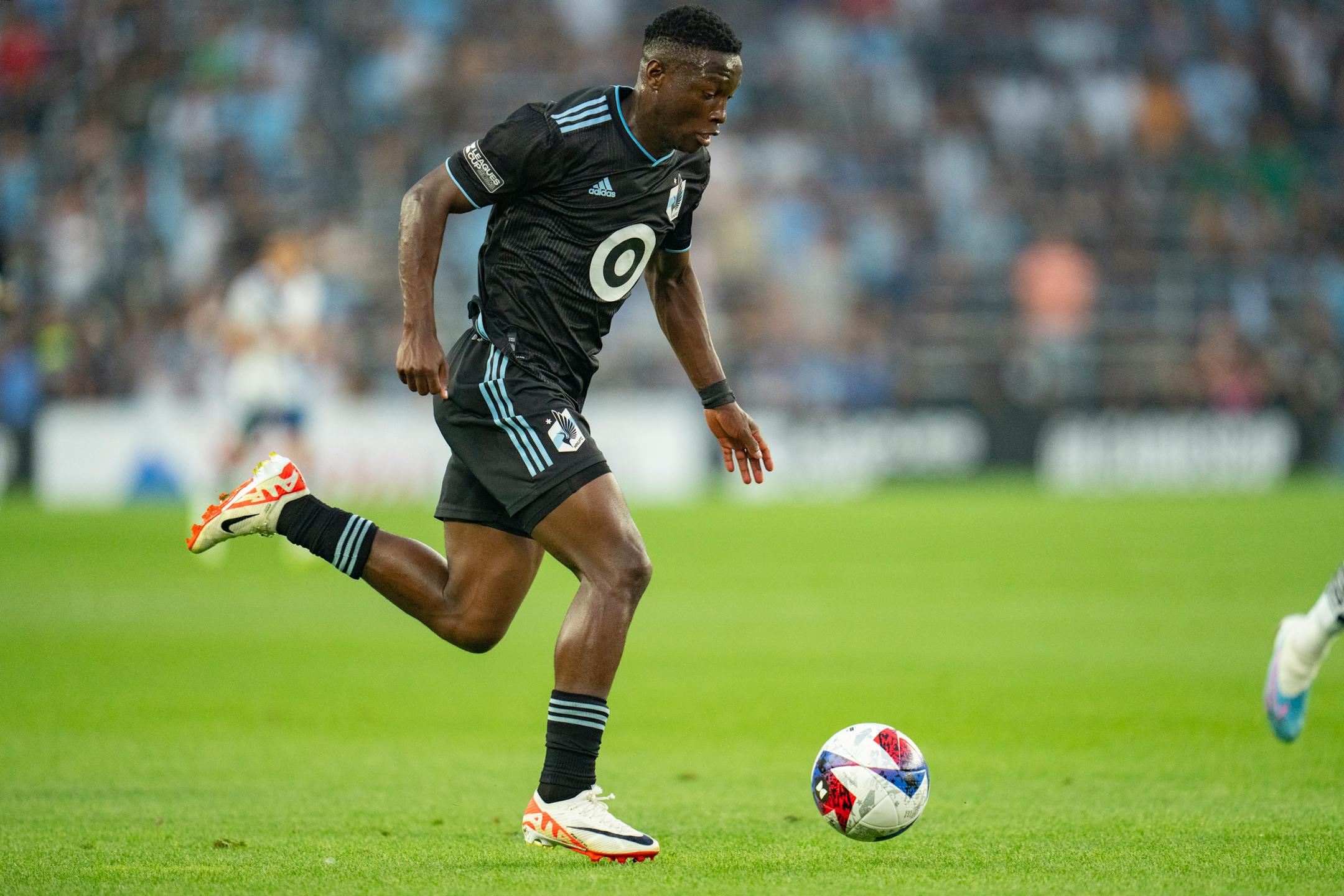 Minnesota United forward Bongokuhle Hlongwane dribbles towards net before scoring against Puebla in the first half of a Leagues Cup match Sunday.