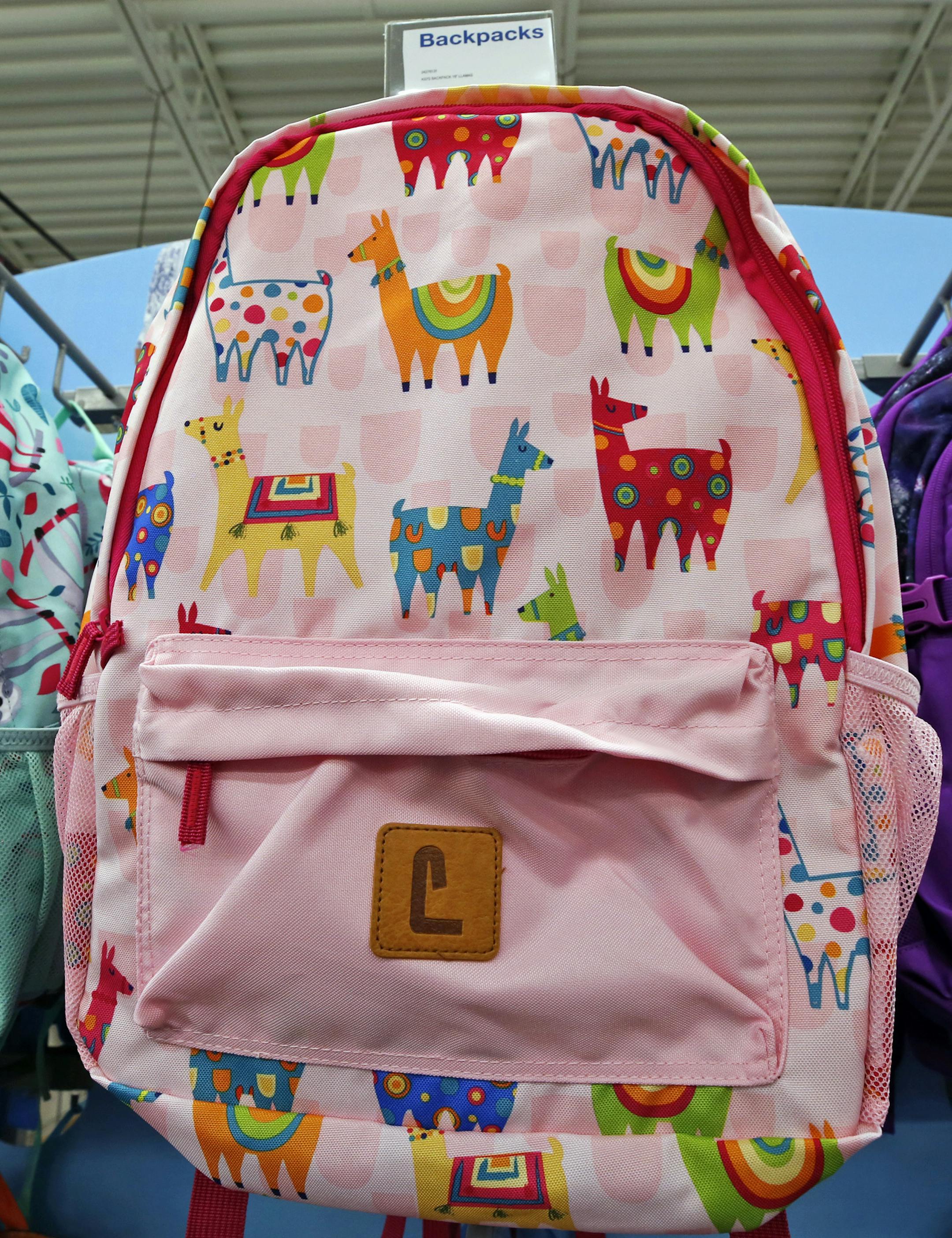 This July 18, 2018, photo shows a display of back to school backpacks in a Staples store in Pittsburgh. Llamas are in demand for decoration on backpacks and other school supplies this year. (AP Photo/Gene J. Puskar) ORG XMIT: PAGP801