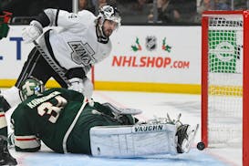 Los Angeles Kings left wing Phillip Danault scores a goal against Wild goaltender Kaapo Kahkonen during the second period Saturday night.