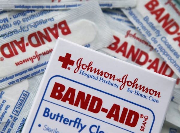 FILE - In this July 14, 2009 file photo, a box of Johnson & Johnson BAND-AID bandages is shown in Boston. Health care giant Johnson & Johnson pulls ou