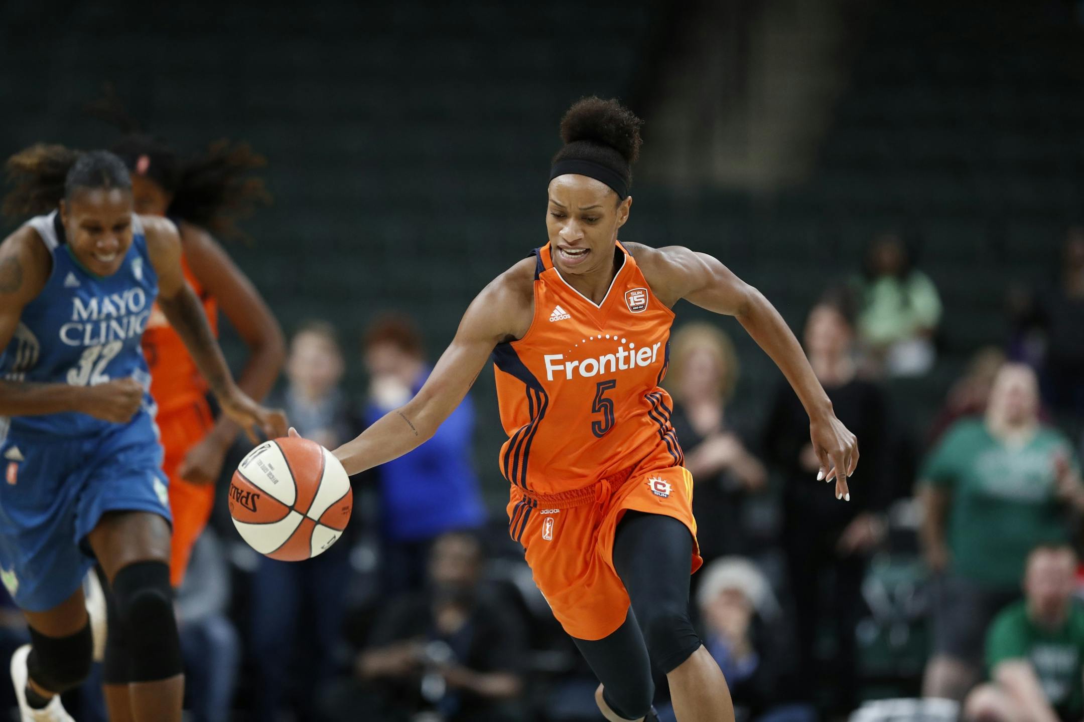 Connecticut Sun guard Jasmine Thomas (5) was chased by Minnesota Lynx forward Rebekkah Brunson (32) in the first half at Xcel Energy Center May 22, 2017 in St. Paul, MN.