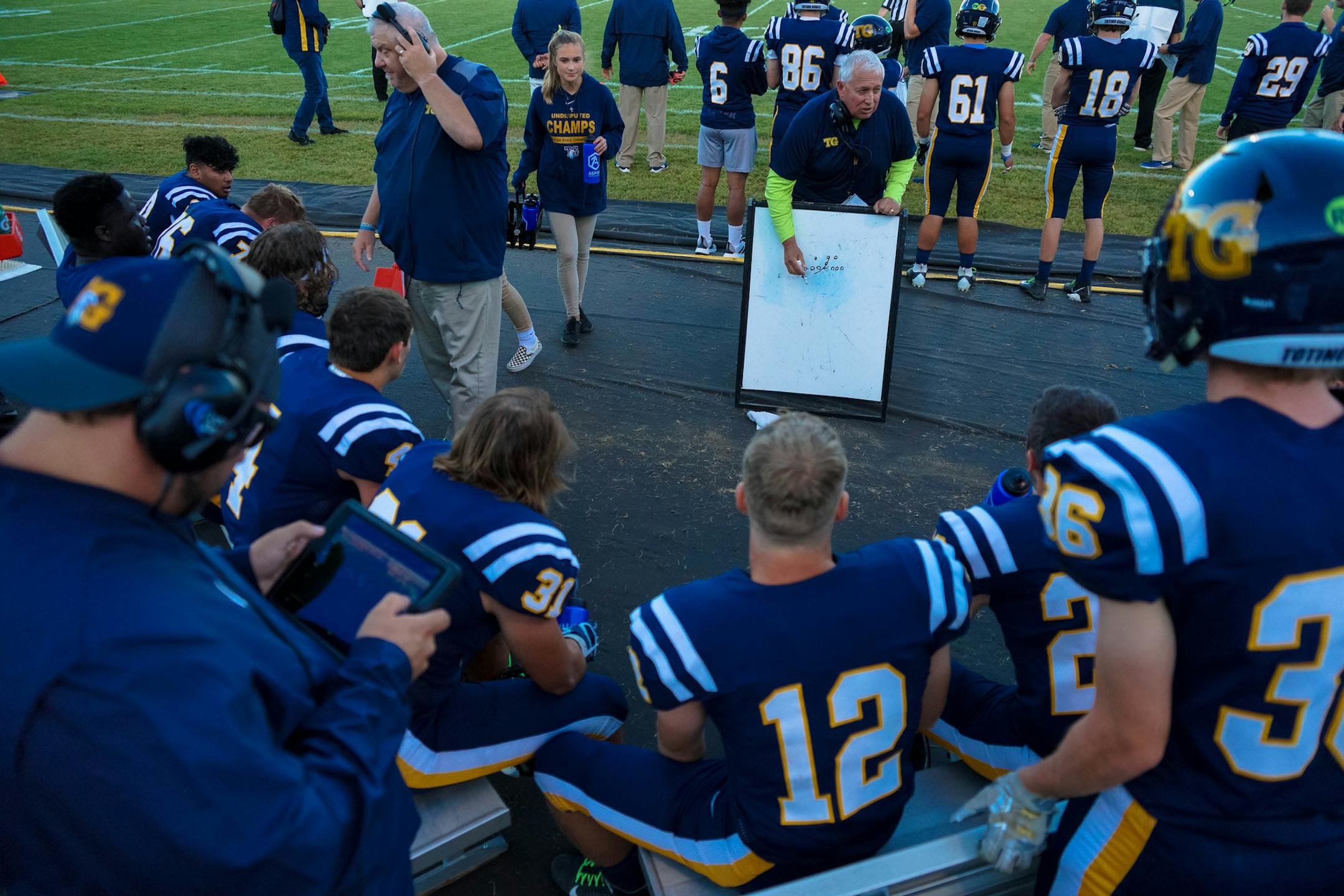 Totino-Grace coach Jeff Ferguson talks to his players during their season-opening game against Lakeville South on Aug. 29. Photo by Korey McDermott, SportsEngine