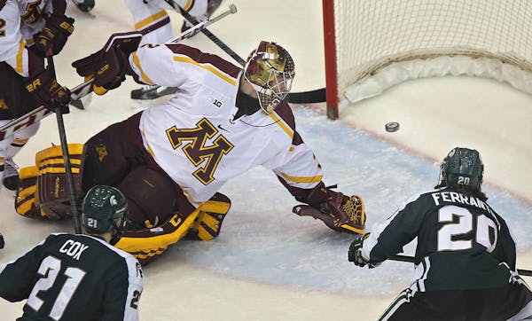 Michigan State‚Äôs Mike Ferrantino (right) slipped the puck past Gopher goalie Adam Wilcox in the first period for a 1-0 lead. ] JIM GEHRZ ‚Ä¢