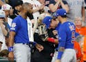 Albert Almora Jr. of the Chicago Cubs was comforted by teammates after checking on a young child who was struck by a hard foul ball off his bat on May