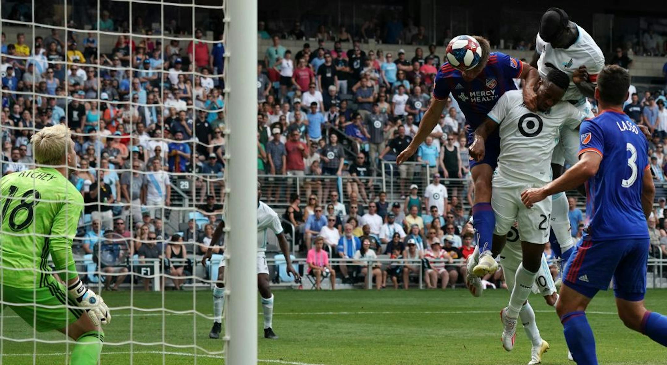 Minnesota United forward Mason Toye (23) blocked FC Cincinnati defender Nick Hagglund (14) as Minnesota United defender Ike Opara (3) headed the ball past FC Cincinnati goalkeeper Spencer Richey (18) in the second half.