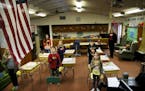 At Angle Inlet School, the last one-room schoolhouse in Minnesota, the school day started with the Pledge of Allegiance. This photo was taken in 2015.