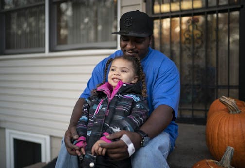 Jamokia Curry worked at Water Gremlin for two years and left this August. His daughter Ja'Naea, pictured, has tested high for lead. They are photographed together outside their home in St. Paul, Minn., on Tuesday, October 29, 2019.