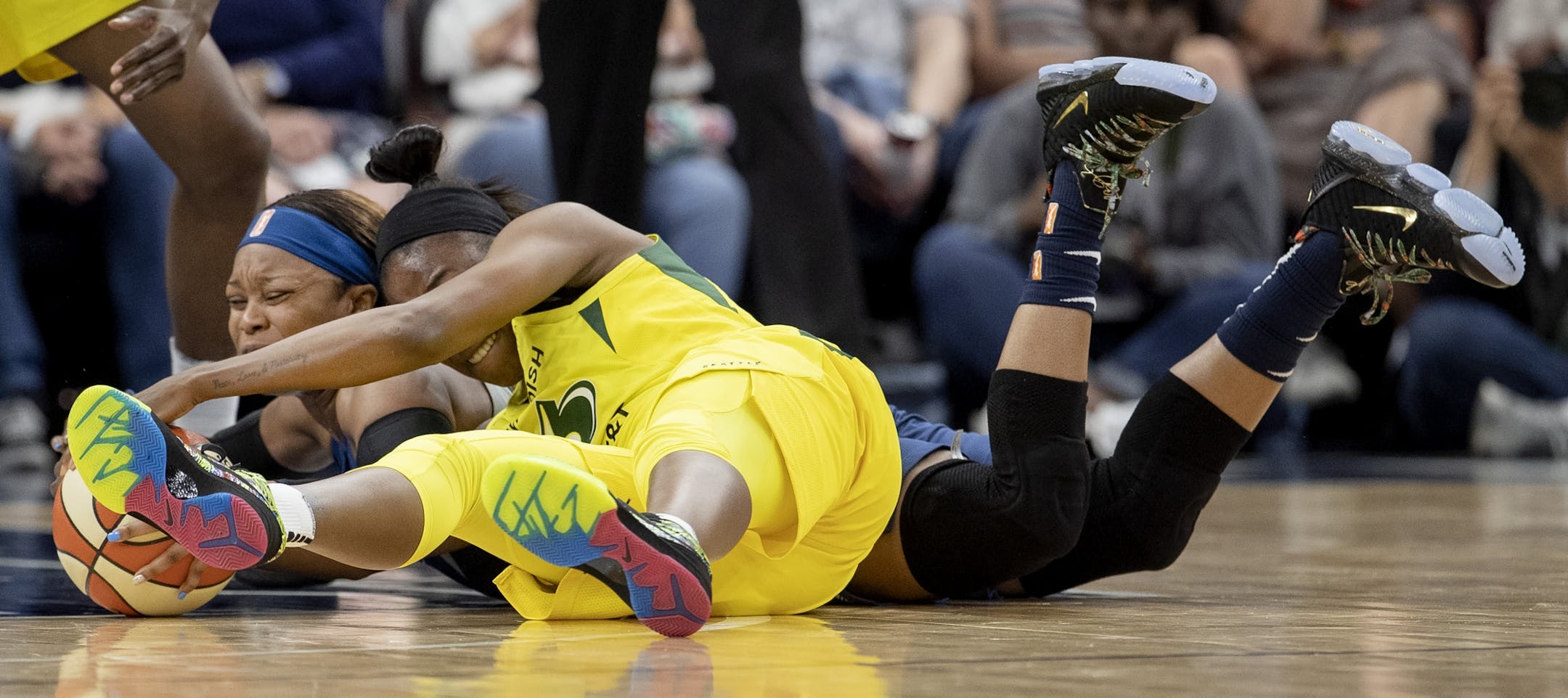 Minnesota Lynx Odyssey Sims and Seattle Storm's Jewell Loyd fought for the ball in the second half.