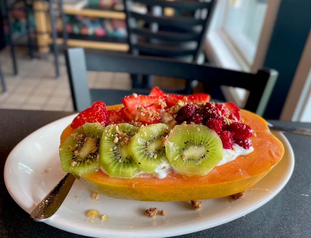 Papaya topped with fresh fruit, yogurt and granola at the new High Hat cafe in St. Paul.