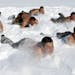 In this Thursday, Feb. 26, 2015 photo, Chinese soldiers from the People's Liberation Army (PLA) take part in a cold endurance training in Heihe in nor