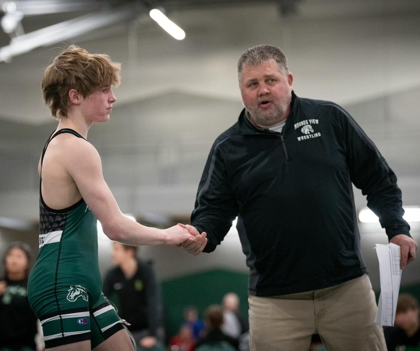 Brett Swenson is congratulated by Mounds View coach Dan Engebretson after winning a match at the 2024 Mustang Duals at Mounds View High School in Arden Hills, Minn., on Saturday, Jan. 13, 2024. ] SHARI L. GROSS • shari.gross@startribune.com