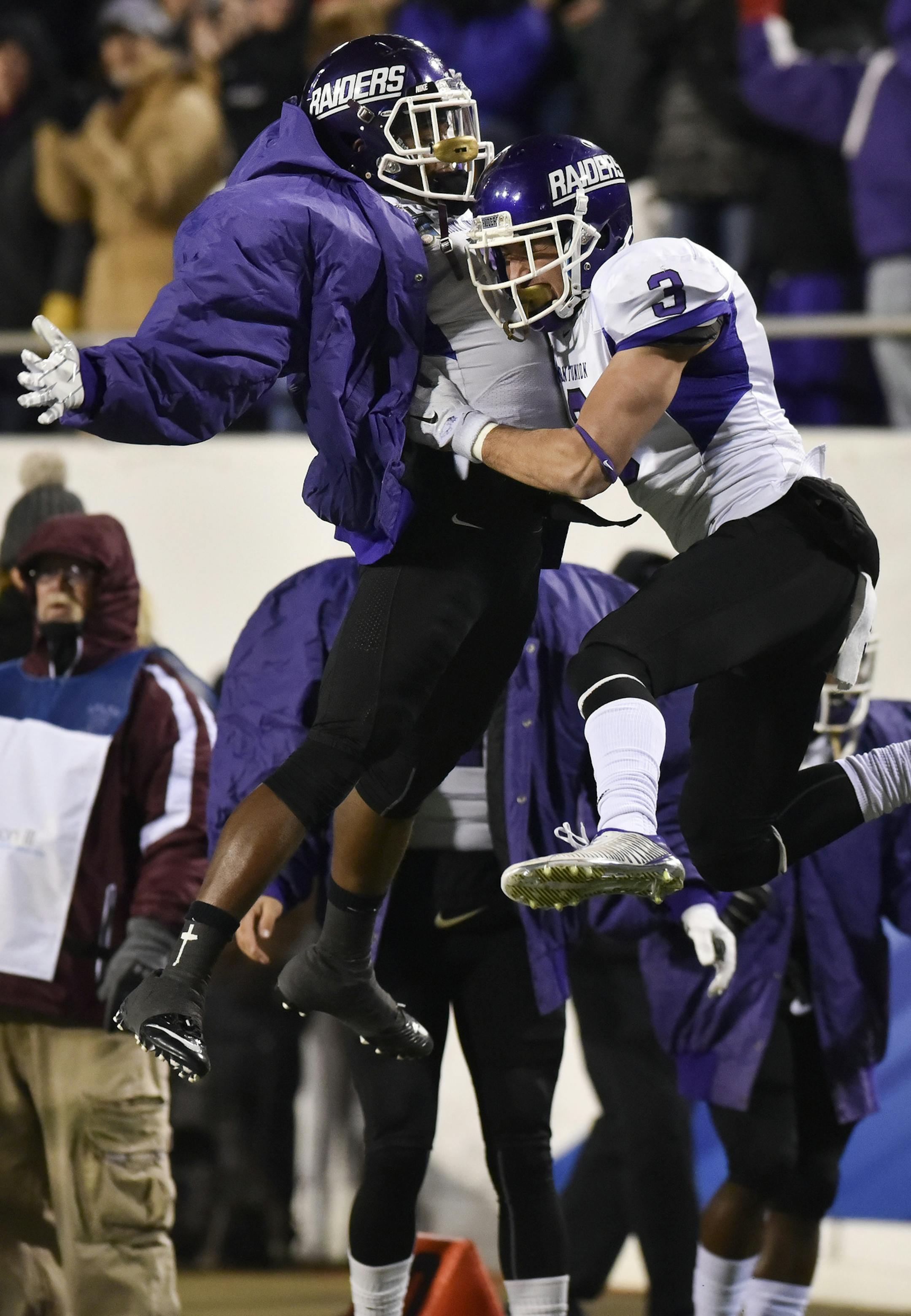 Mount Union wide receiver Roman Namdar (3) celebrates his touchdown reception with defensive back Tre Jones, against St. Thomas during the first half of the NCAA Division III football championship game in Salem, Va., Friday, Dec. 18, 2015. (AP Photo/Michael Shroyer)