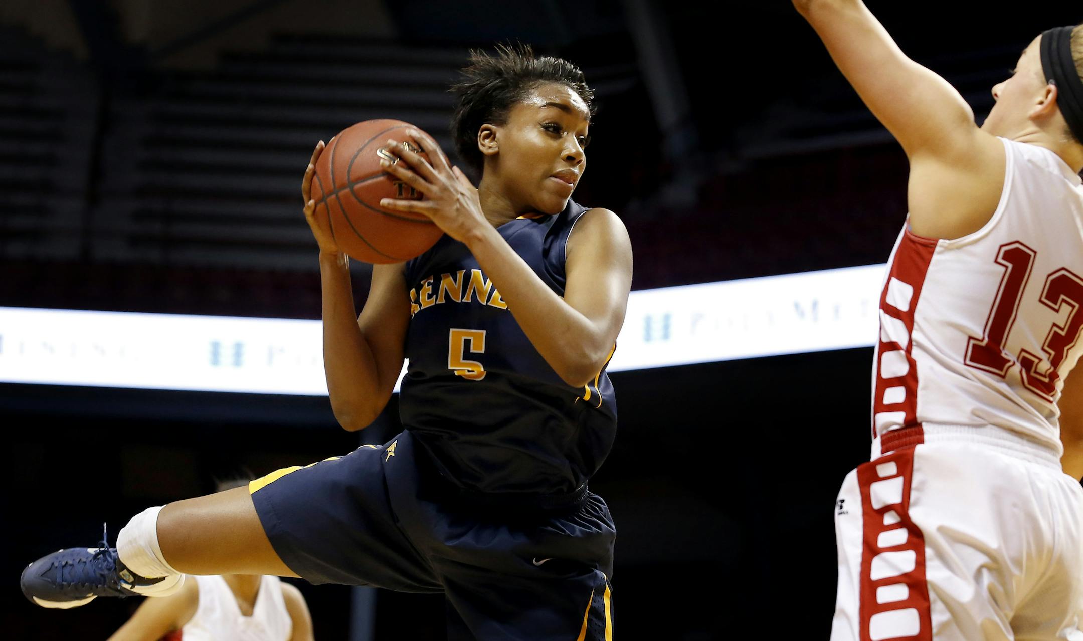 Tonoia Wade (5) of Bloomington Kennedy was defended by Erika Rozell (13) of Lakeville North in the first half. ] CARLOS GONZALEZ cgonzalez@startribune.com - March 20, 2014 , Minneapolis, Minn., Williams Arena, Class 4A girls' basketball semifinals, Lakeville North vs. Bloomington Kennedy,