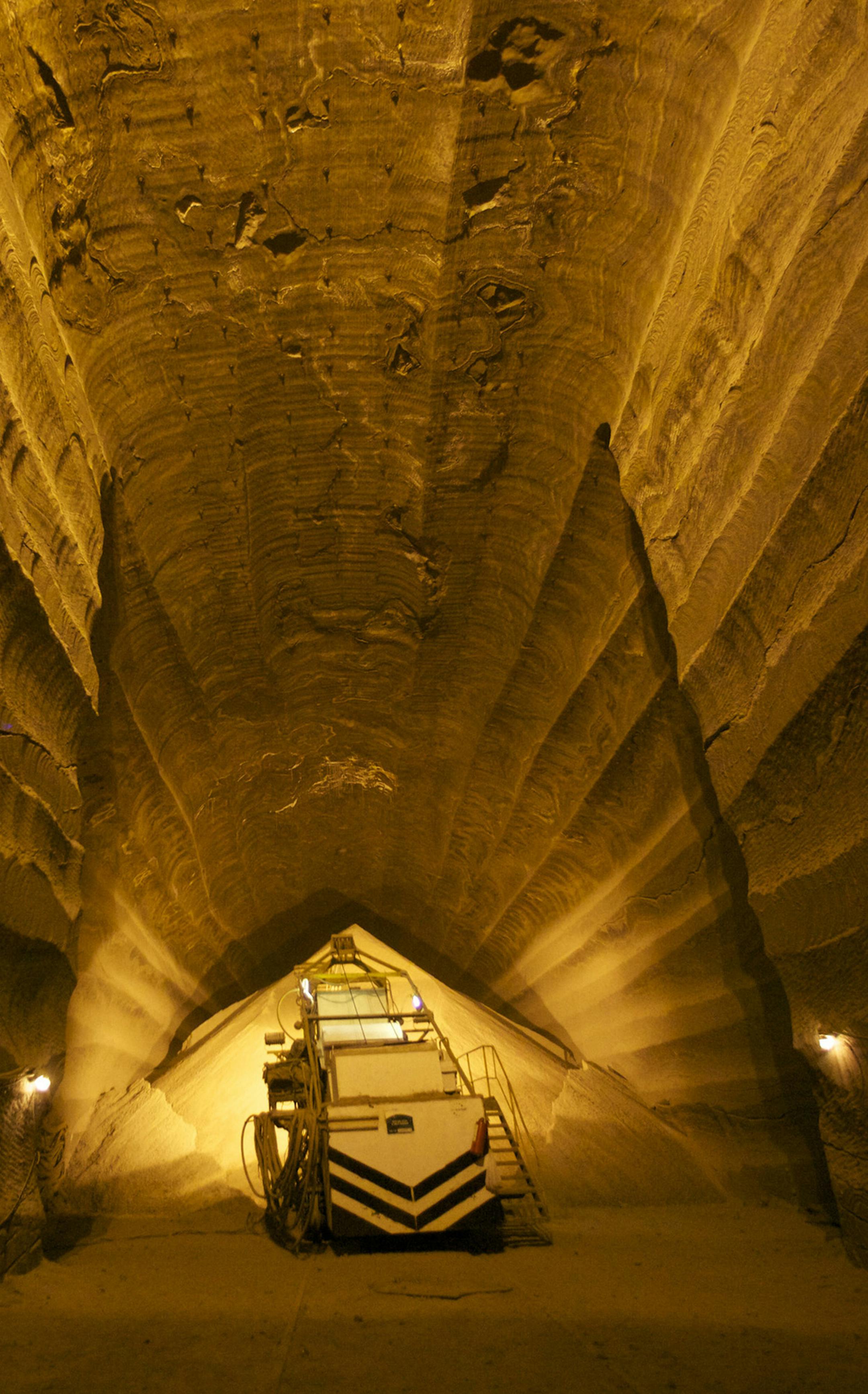 A machine moves a store of recently excavated potash ore in the OAO Uralkali mines in Berezniki, Russia, on Thursday, March 17, 2011. Uralkali plans to merge with domestic rival OAO Silvinit to overtake Potash Corp. of Saskatchewan Inc. as the largest producer. Photographer: Alexander Zemlianichenko Jr/Bloomberg ORG XMIT: 110400510