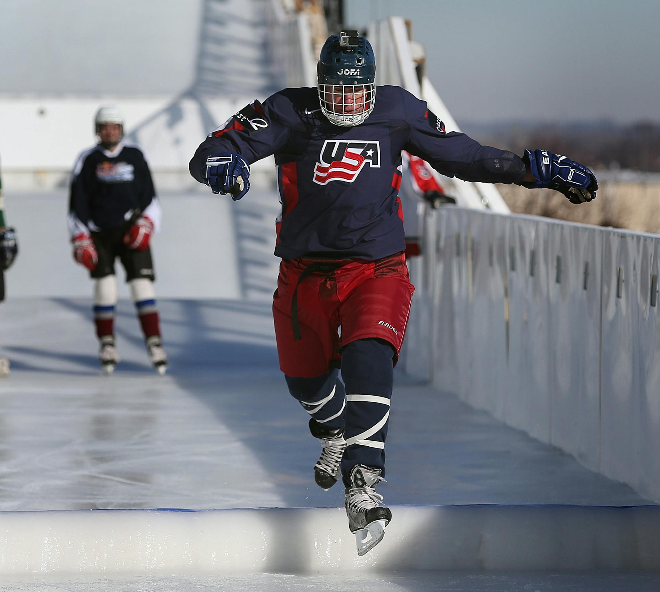Above: St. Paul Mayor Chris Coleman carefully skated the Red Bull Crashed Ice course, which begins in the shadow of the St. Paul Cathedral. At left was Coleman’s son Aiden. The Colemans and two others tested sections of the track Wednesday. TOP: The mayor was all smiles talking about the event, in its third year in St. Paul.
