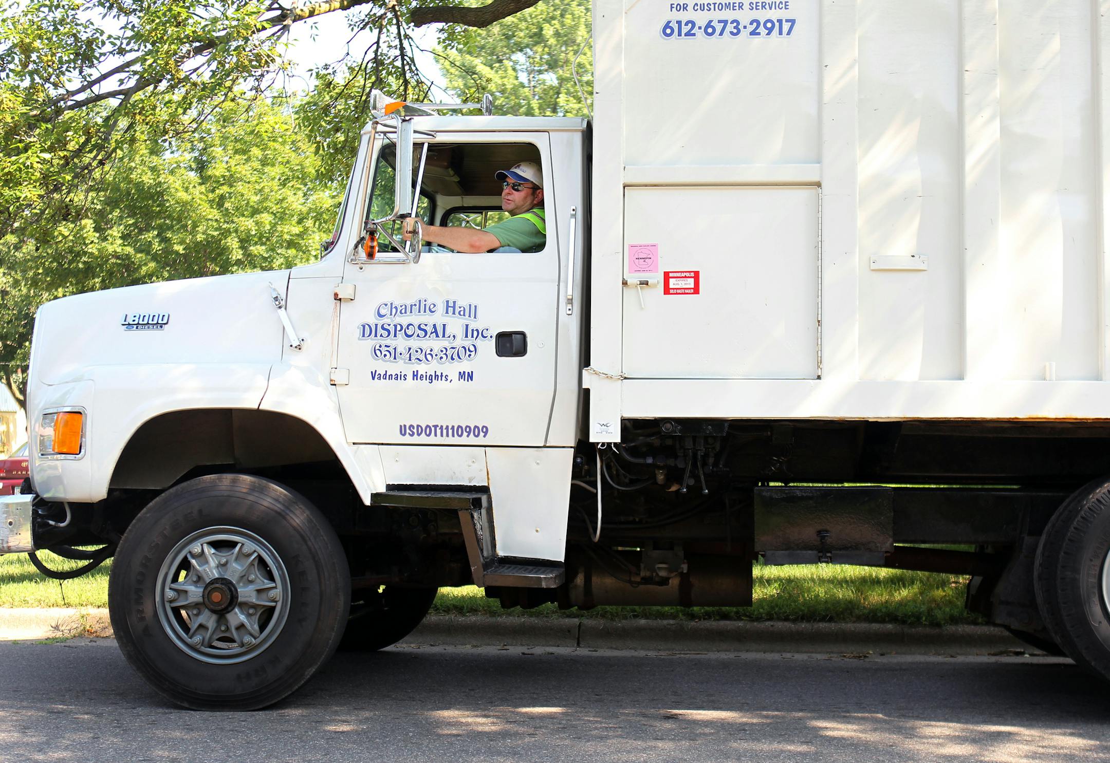 Charlie Hall, of Charlie Hall Disposal, Inc., and Chairman of the Board for the Minneapolis Refuse Inc., drives one of his garbage trucks around to collect trash in Minneapolis, Minn., on Monday, July 15, 2013. ] (ANNA REED/STAR TRIBUNE) anna.reed@startribune.com (cq)