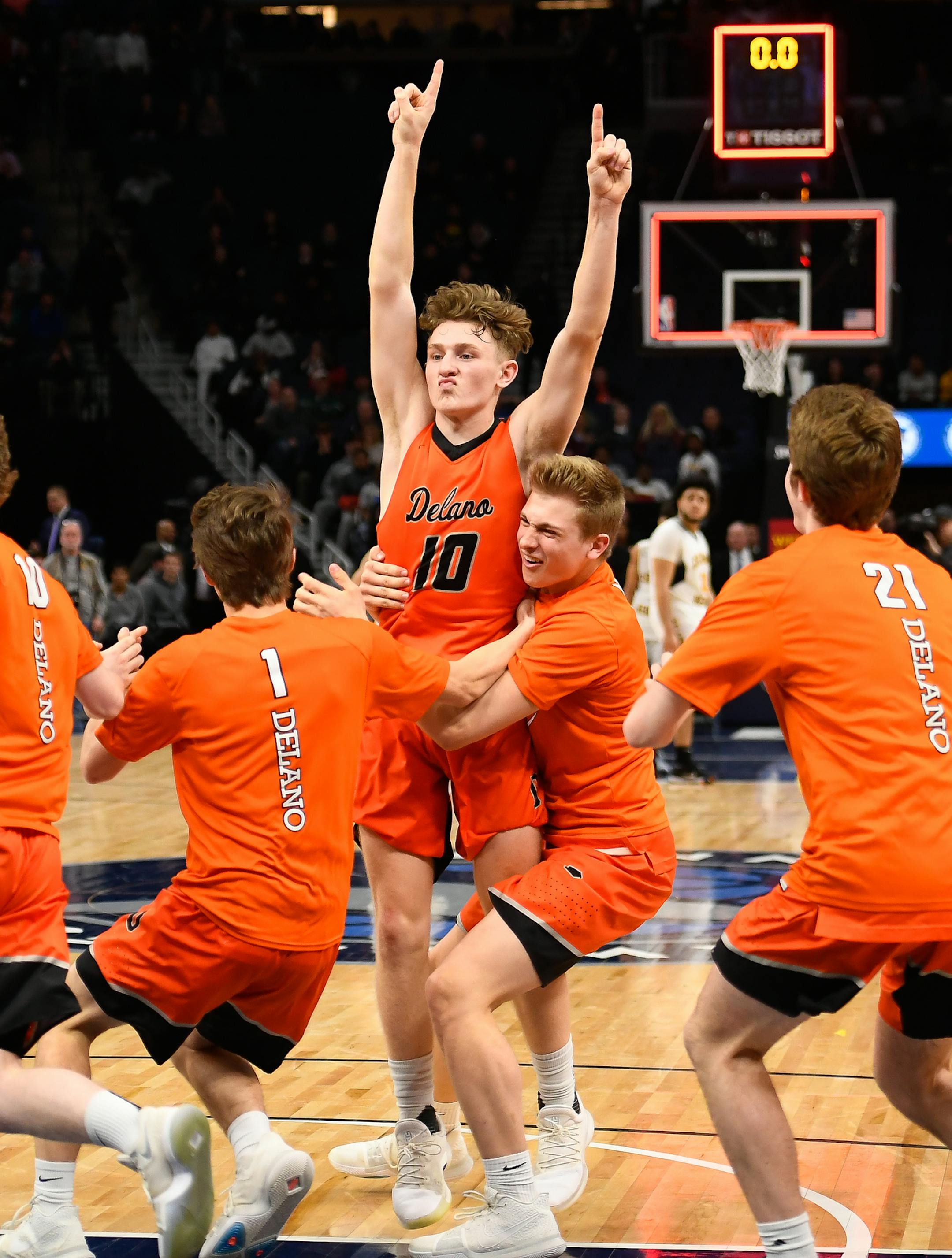 Delano players celebrated their 65-61 3A championship victory over Columbia Heights. ] AARON LAVINSKY ï aaron.lavinsky@startribune.com Delano played Columbia Heights in the Class 3A boy's basketball championship game on Saturday, March 24, 2018 at Target Center in Minneapolis, Minn.