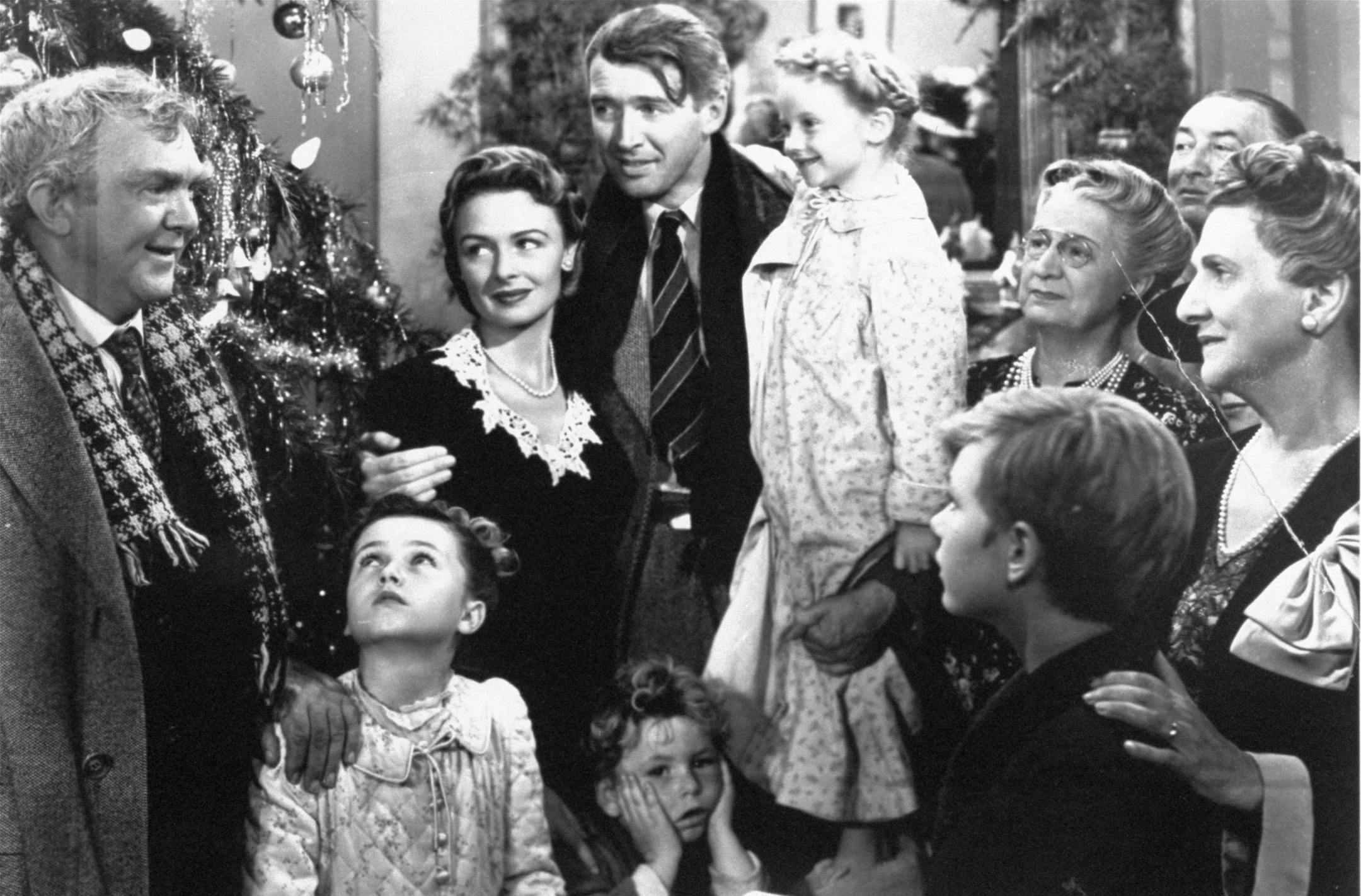** ADVANCE FOR WEEKEND, DEC. 23-24 **FILE**James Stewart, center, as George Bailey is reunited with his wife, played by Donna Reed, left center, and their children during the final scene of Frank Capra's 1946 movie, "It's A Wonderful Life." Stewart has his arm around child actress Karolyn Grimes, who played his daughter Zuzu. Actor Thomas Mitchell, as Uncle Billy, stands at left. (AP Photo/RKO) ORG XMIT: NY318
