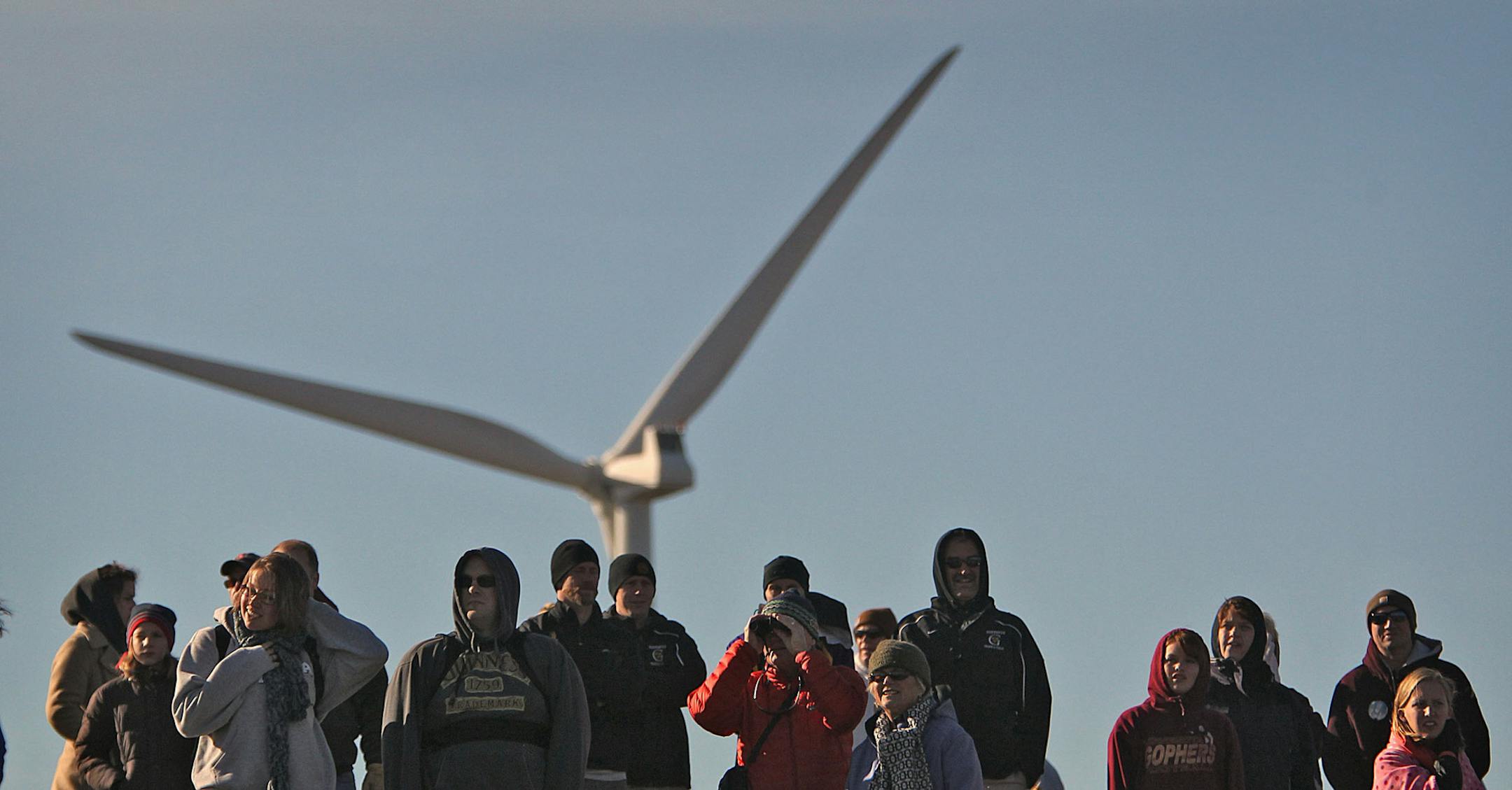 JIM GEHRZ ‚Ä¢ jgehrz@startribune.comNorthfield/November 6, 2010/11:00 AMAthletes gathered at St. Olaf College in Northfield to compete in the Class A Girls State High School Cross-Country Running Meet. IN THIS PHOTO:] Fans watched the race as a wind turbine generated electricity behind them.