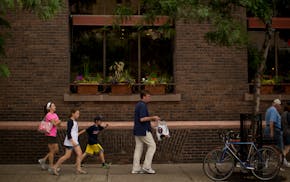 People walking in front of Butler Square.