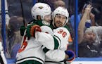 The Wild's Mats Zuccarello, right, celebrated with Jason Zucker after scoring the go-ahead goal in the third period of Minnesota's 5-4 victory over Ta