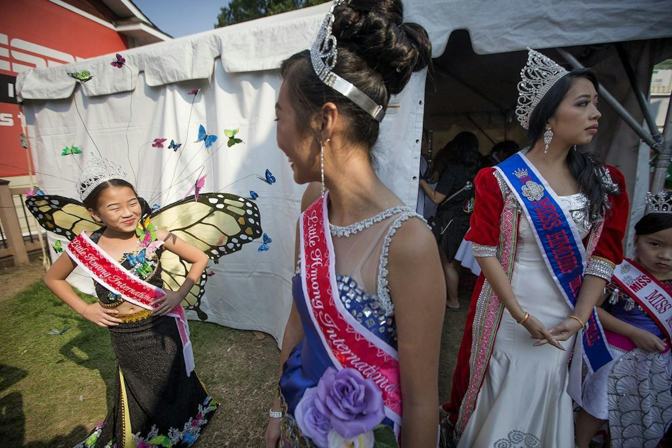 Pa Koua, 13, left, showed off her butterfly outfit to others during a Hmong Fashion Show on the last day of the Minnesota State Fair, Monday, September 4, 2017 in Falcon Heights, MN.