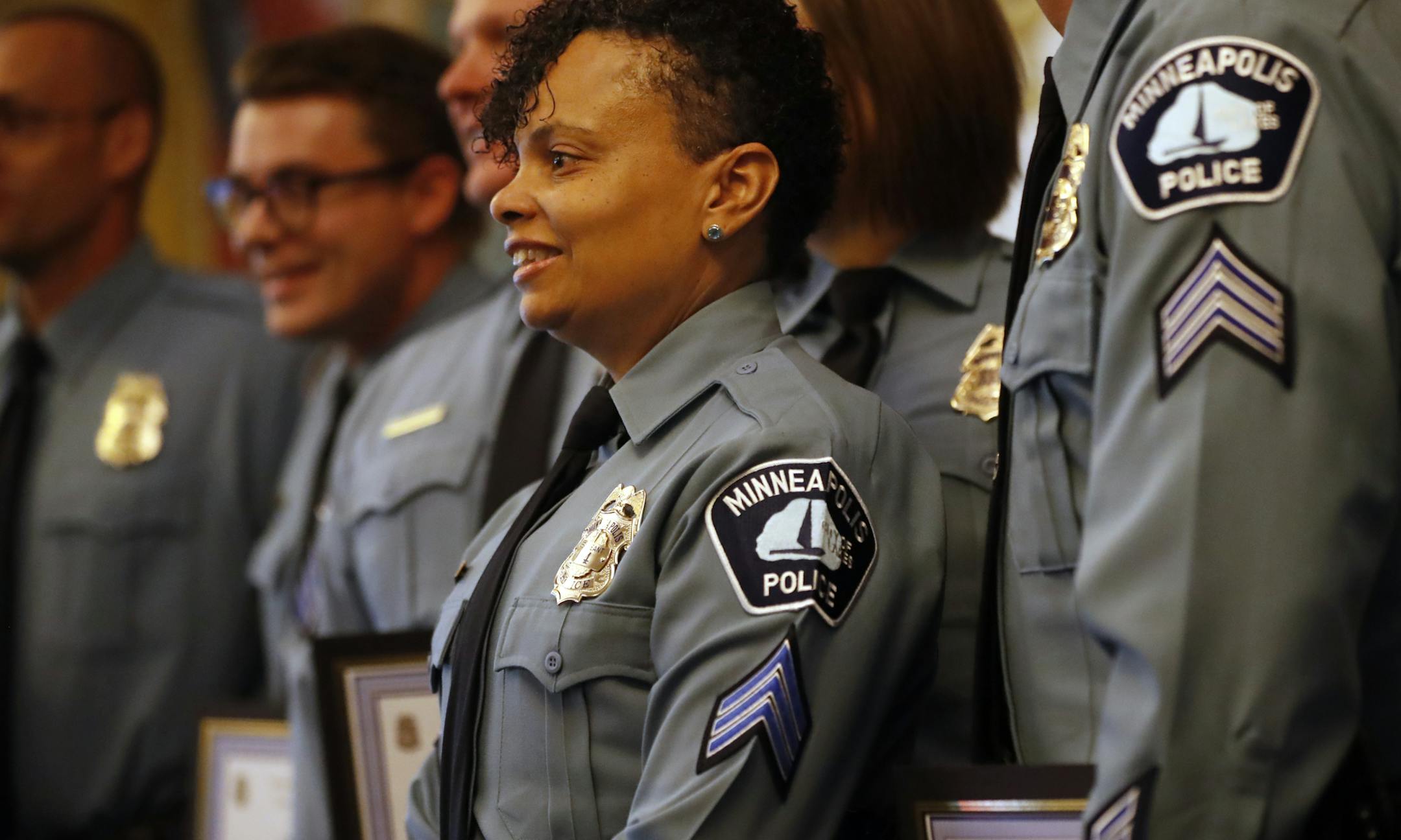 Newly promoted to sergeant, Renee Lewis stood with her colleagues on Monday after they were officially sworn in to their new roles with the department.