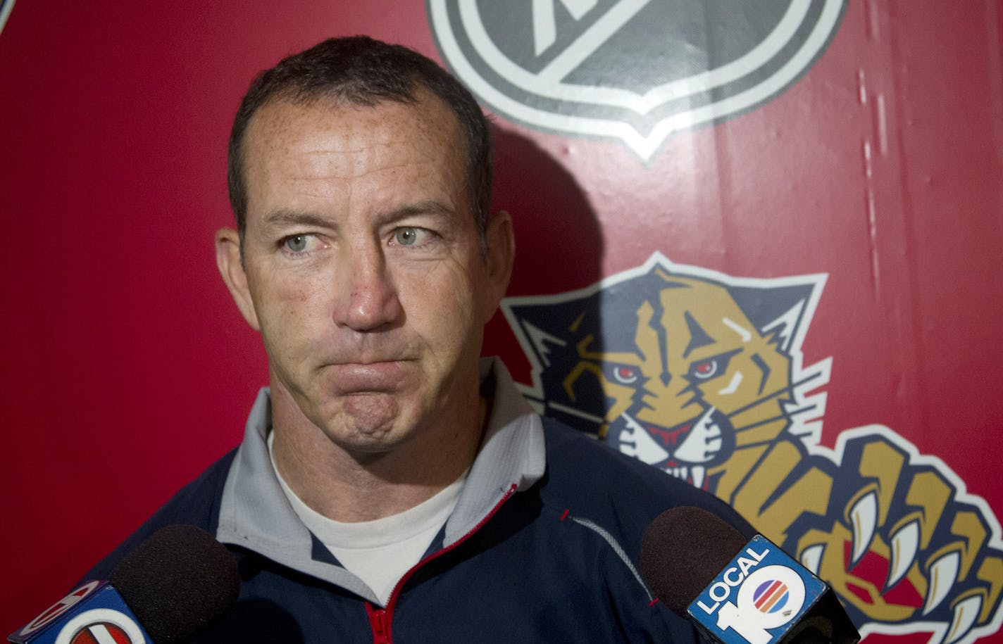 FILE - In this Sept. 14, 2012 file photo, Florida Panthers hockey coach Kevin Dineen talks to the media, after an informal skate in Coral Springs, Fla. Dineen has been fired as coach of the Panthers. The team made the announcement Friday, Nov. 8, 2013, one day after their losing streak reached seven with a 4-1 loss at Boston. Also fired were assistants Gord Murphy and Craig Ramsay. Peter Horachek is the Panthers' interim head coach. (AP Photo/J Pat Carter, File)