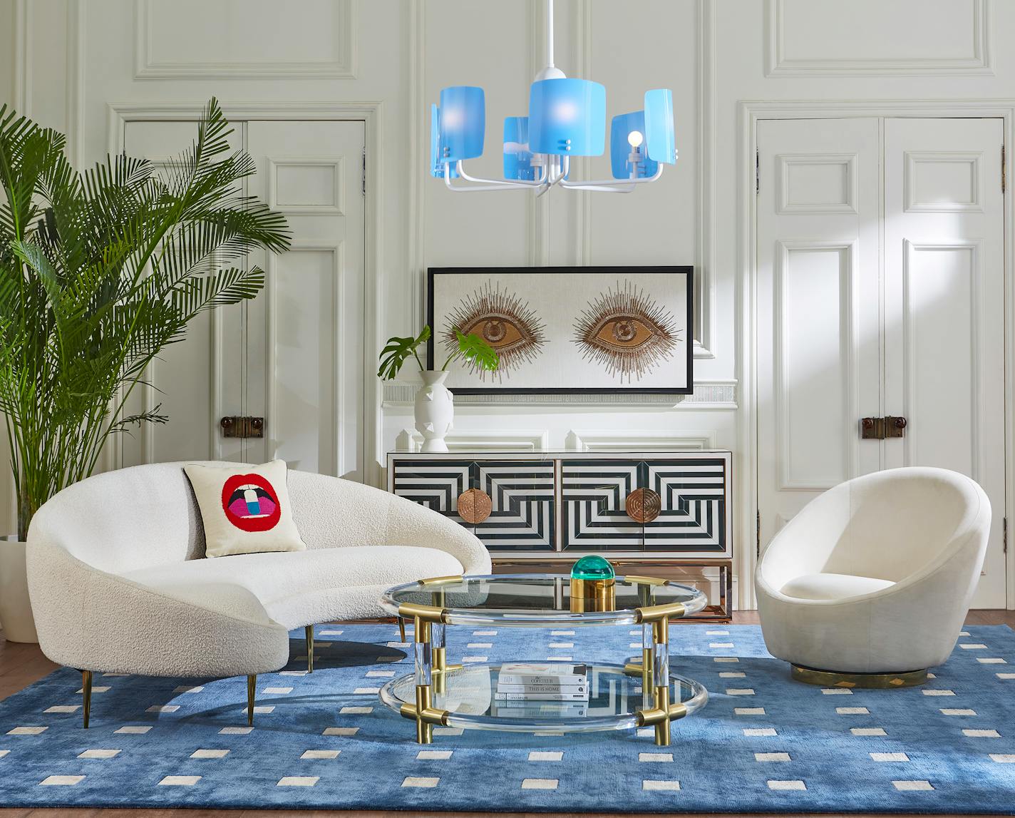 Jonathan Adler's Wondrium decorating series emphasizes expressing your own personality in your home. Here, his Ether curved sofa with stiletto legs and his "Eyes" wall art are two strong statement pieces. MUST CREDIT: Courtesy of Jonathan Adler