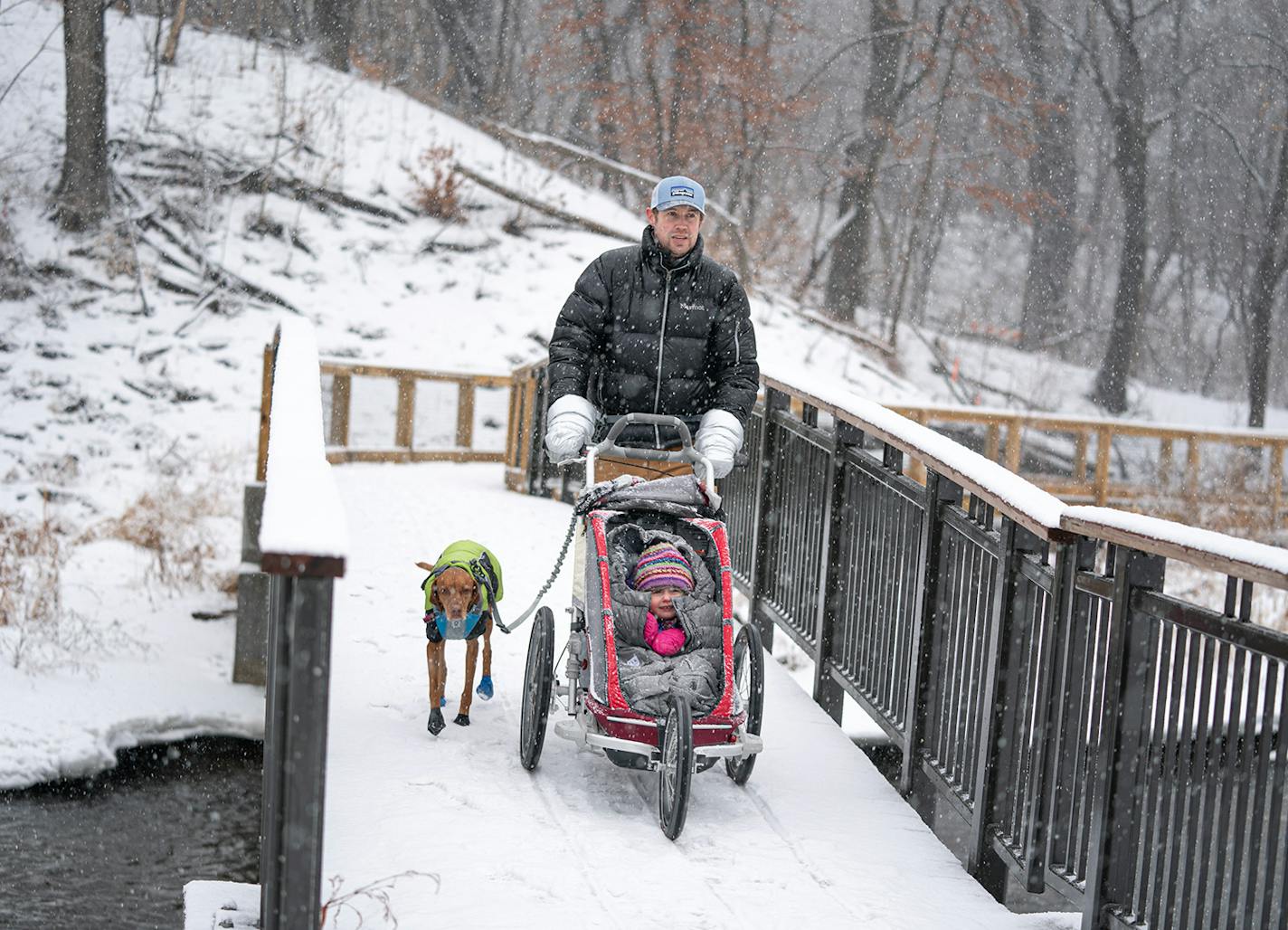 Havey pushed Liesl in a Thule Chariot Cross, a stroller for all terrain. For warmth, he used mitts specially designed to attached to the handlebars.