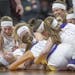 Goodhue's team celebrated their 47-43 win over Menahga after their match-up of the Class 1A girls' basketball state tournament semifinals at Williams 