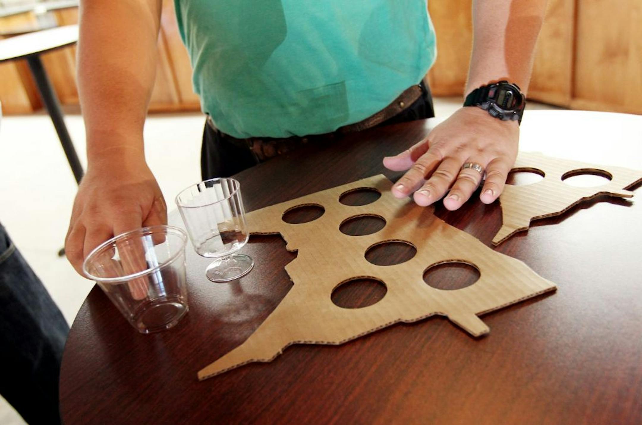 Jeff McClure displays the wine flight service trays in the new Minnesota Wine Country building at the Minnesota State Fair in Falcon Heights August 17, 2012.