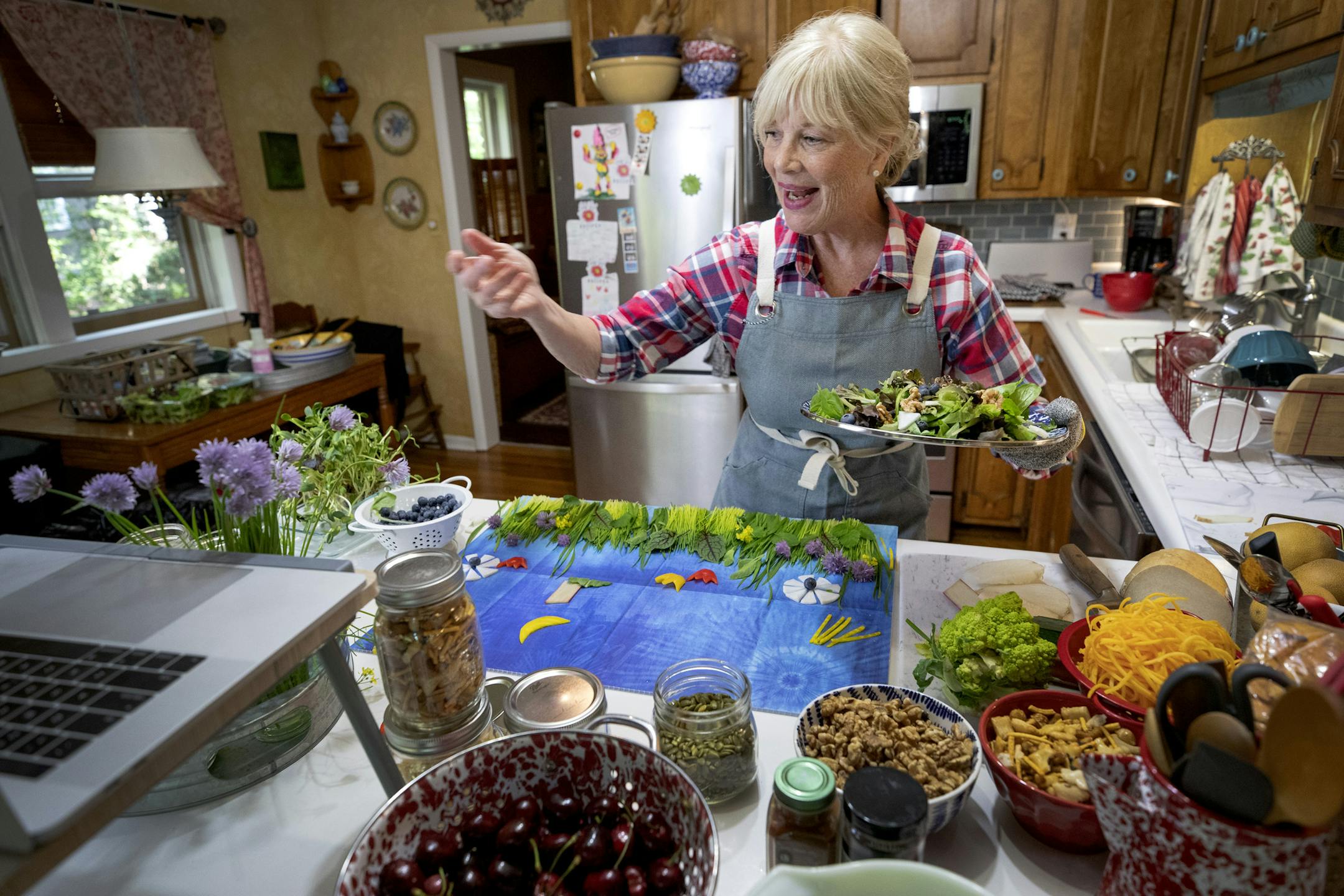 Pam Powell prepared a salad in her kitchen. Powell is the founder and owner of the Salad Girl line of salad dressings. ] CARLOS GONZALEZ • cgonzalez@startribune.com – Minneapolis, MN – June 10, 2019, Midtown Greenway that abruptly ends at W. River Parkway before the near the Canadian Pacific railroad bridge over the Mississippi River. Extending the Midtown Greenway into St. Paul using an existing railroad bridge would cost between $5 million and $27.5 million, according to t