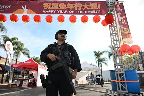 Monterey Park police officers stand at the scene of a mass shooting in Monterey Park, California, on Sunday, Jan. 22, 2023. (Robyn Beck/AFP/Getty Images/TNS) ORG XMIT: 69740721W