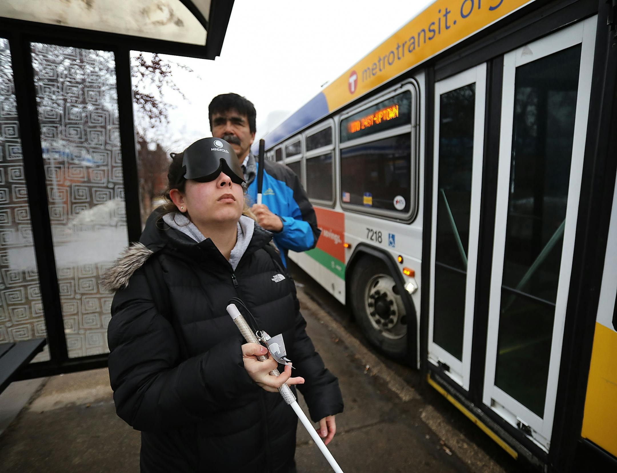 Through a class at Blind, Inc. Angie Castro, 30, who is blind, is learning to navigate Minneapolis, including crossing busy streets around Blind, Inc. headquarters, near the Minneapolis Art Institute. Castro, wearing sleep shades, was out with Mark Erickson, cane travel instructor, familiarizing herself with the city and bus routes Thursday, March 5, 2020, in Minneapolis, MN.