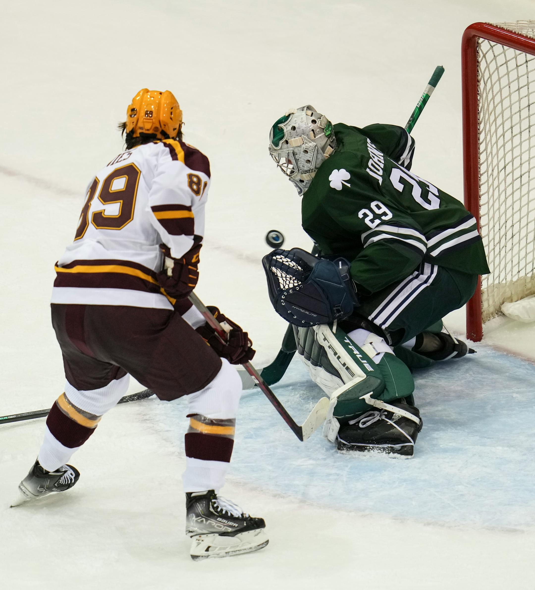 Minnesota forward Mason Nevers' (18) shot got past Mercyhurst goaltender Hank Johnson (29) for a Minnesota point in the first period.