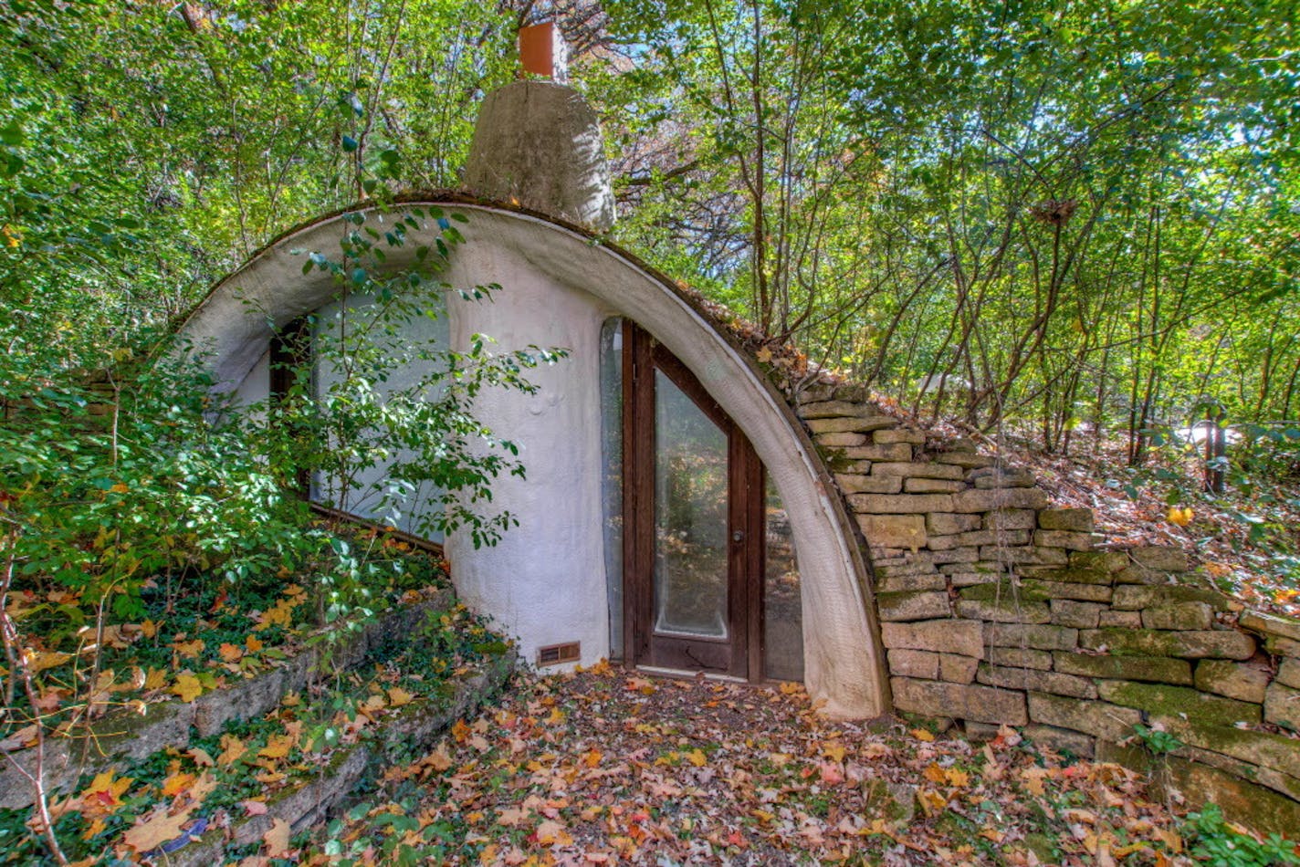 This earth-sheltered house on a wooded acreage in River Falls, Wis. on the market for $285,000.