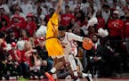 It was a defensive battle in Houston as Iowa State's Curtis Jones (5) defended against Mylik Wilson (8) in the first half. Jones, who played at Cretin