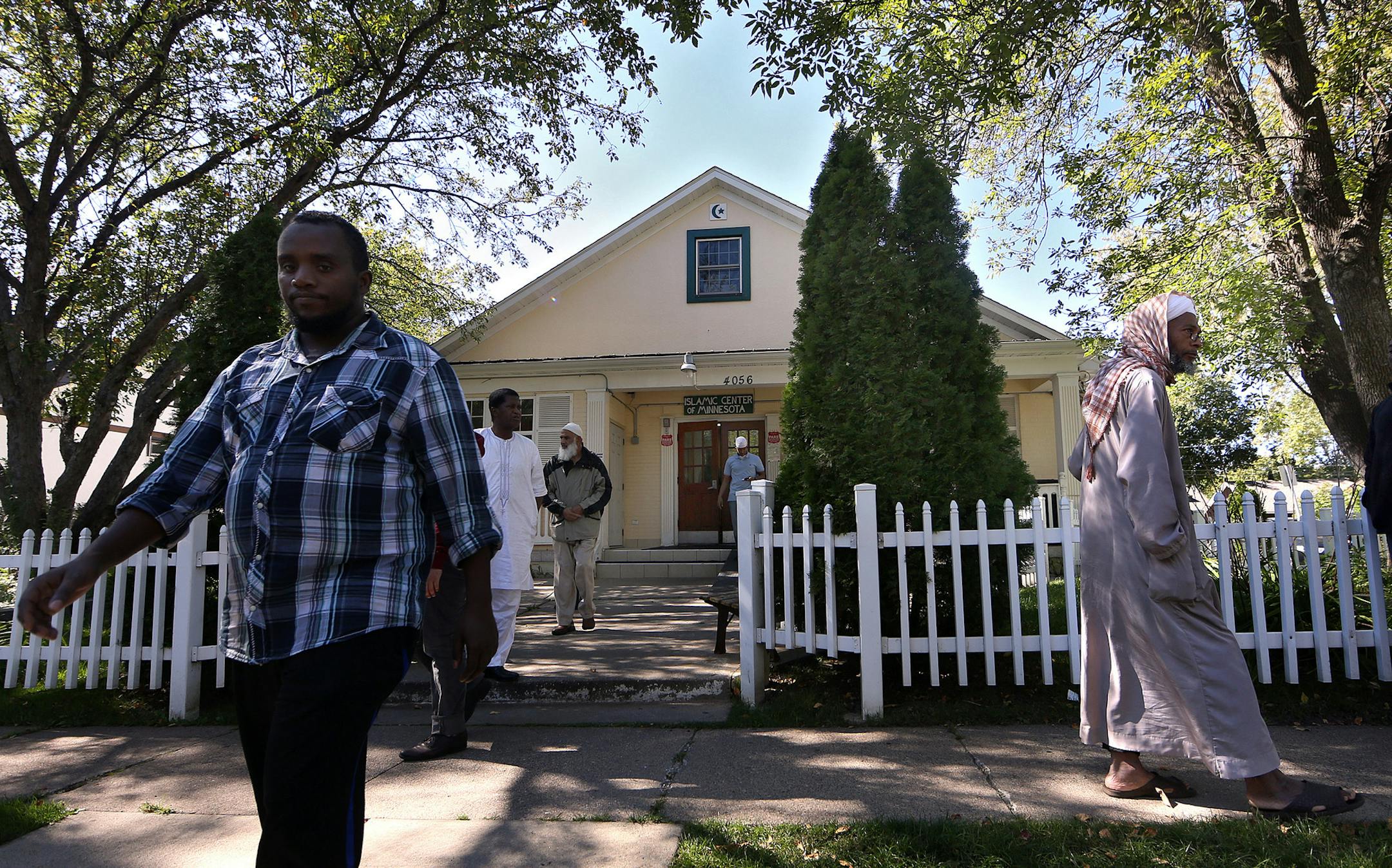 Men filled the street outside the Islamic Center of Minnesota in Columbia Heights following a mid-afternoon prayer and meeting.
