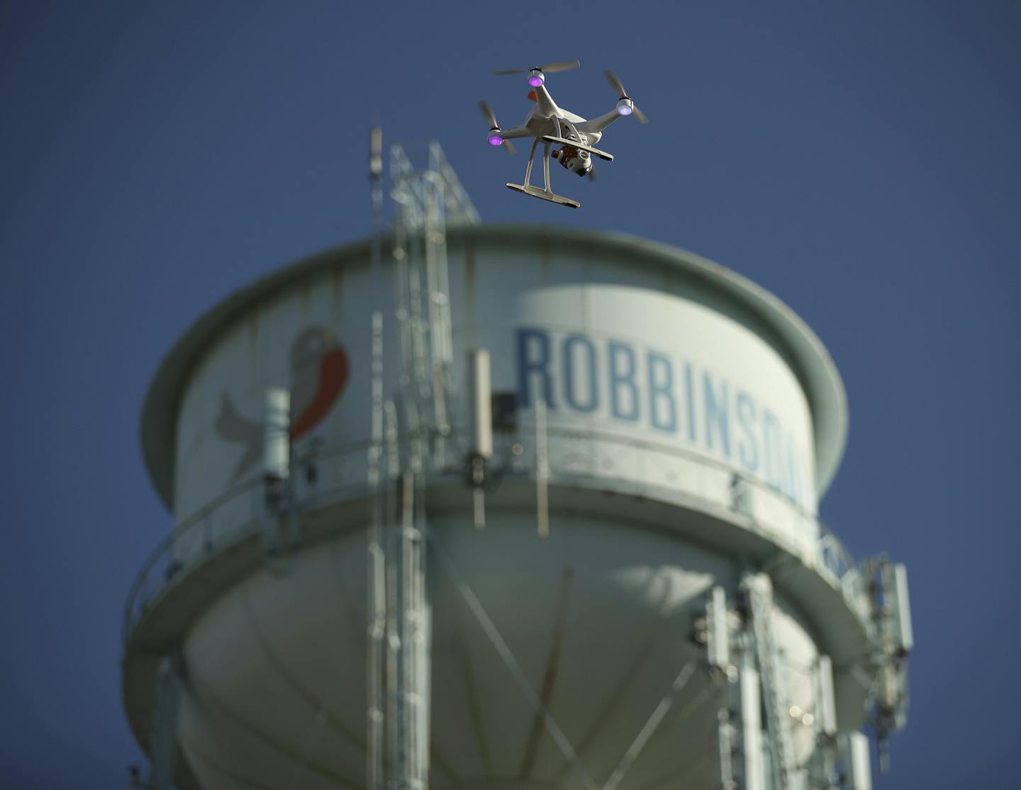 The drone piloted by Tyler Mason flew past the Robbinsdale water tower to shoot footage of the transportation hub for a film. ] JEFF WHEELER &#xef; jeff.wheeler@startribune.com Tyler Mason, a drone operator with AirVuz, was working with Sean Skinner to shoot aerial footage of Robbinsdale Tuesday evening, July 12, 2016 for a film Skinner is making on the Terrace Theater.