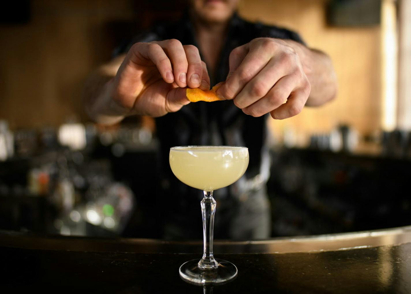 Preparing a cocktail at Tattersall Distilling in Minneapolis. (AARON LAVINSKY)