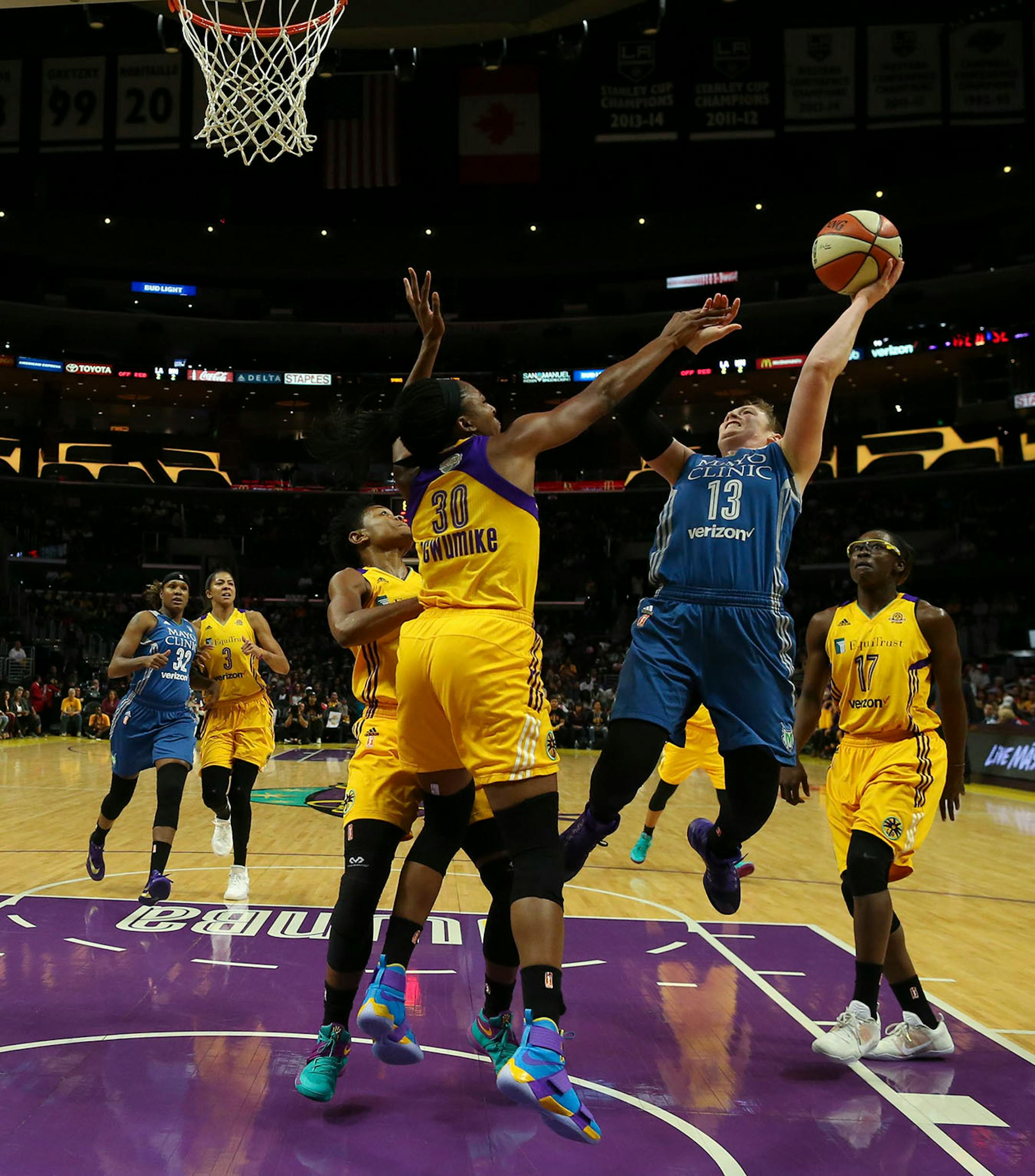 Minnesota Lynx guard Lindsay Whalen (13) with a first quarter shot over Los Angeles Sparks forward Nneka Ogwumike (30).