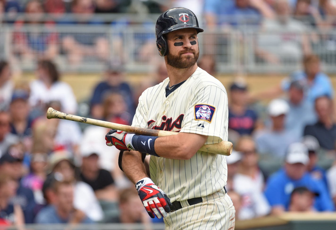 Joe Mauer heads back to the dugout after being called out on strikes against the Cubs in the fourth inning, Saturday June 20, 2015, in Minneapolis.