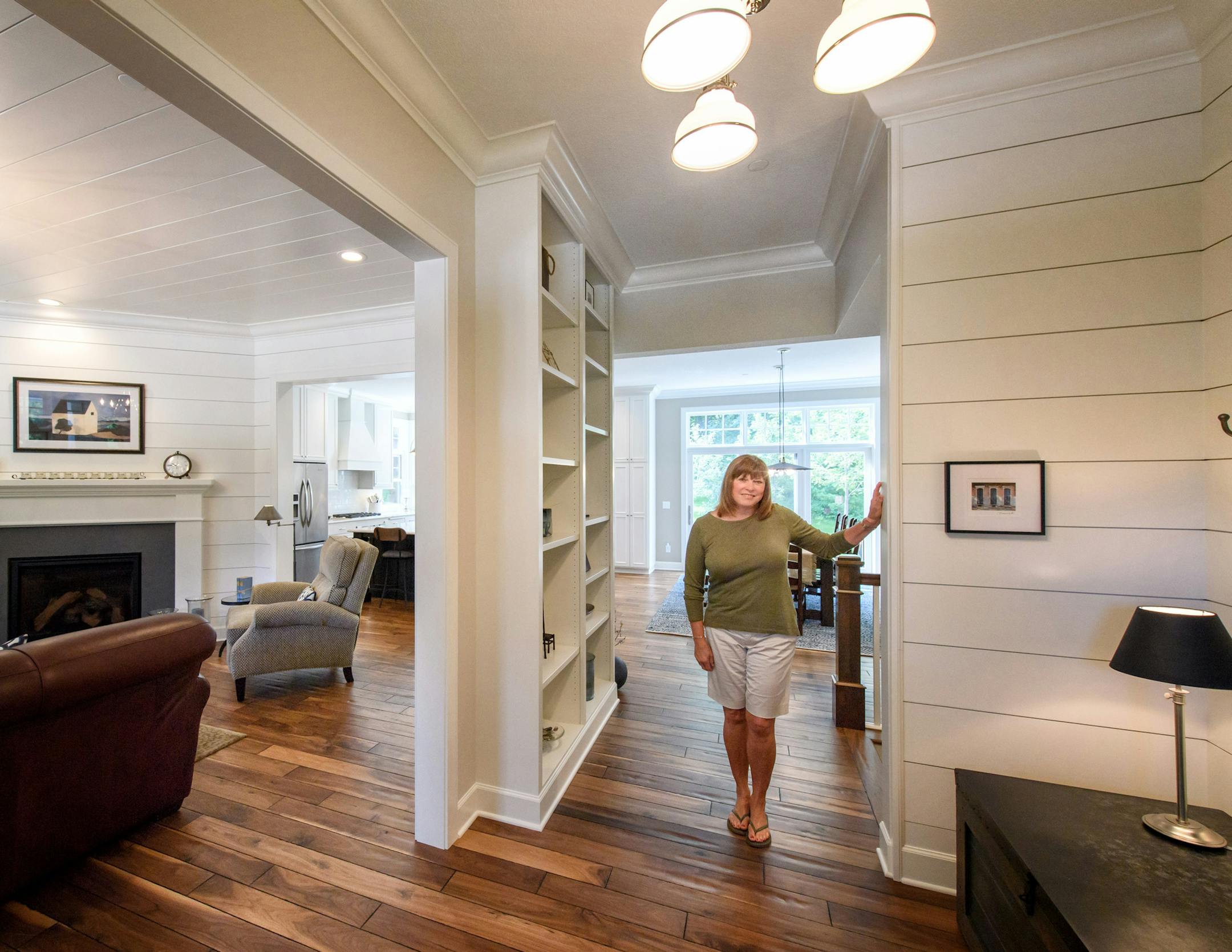 Living room, kitchen and dining room. Jackie Chase built a bigger, kid-friendly house in Mendota Heights as a magnet for her grandkids.
