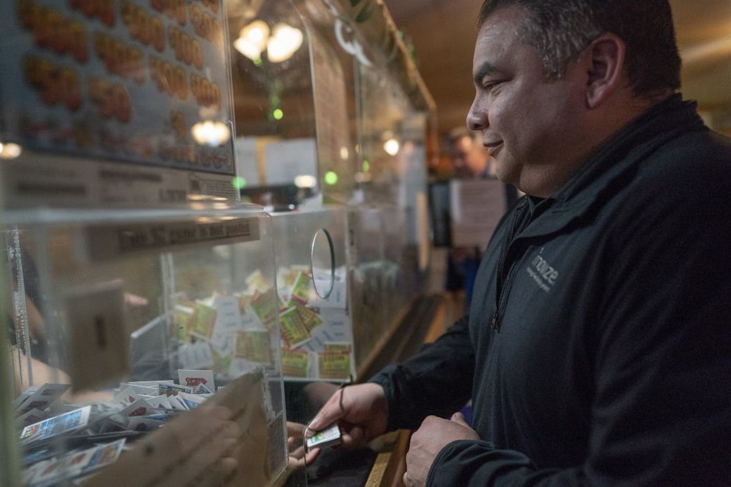 Victor Hernandez of Highland Park purchased forty dollars of pull tabs Wednesday March 6, 2019 at Skinner's Bar in St.Paul, MN.