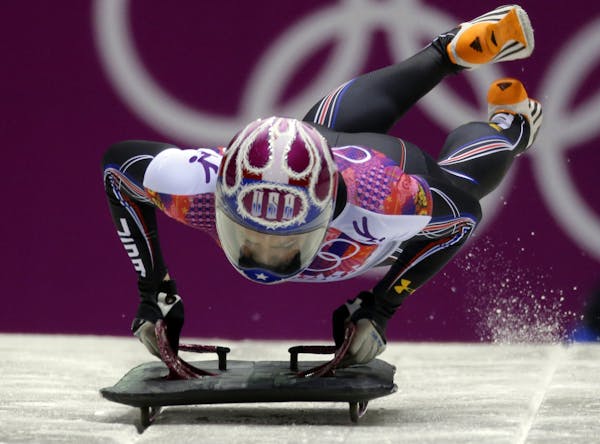 Noelle Pikus-Pace of the United States starts her final run during the women's skeleton competition at the 2014 Winter Olympics, Friday, Feb. 14, 2014